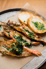 grilled shrimp in garlic sauce with crispy bread