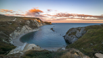 Amazing sunset at Durdle Door, the beutiful landmark on Dorset Coast in South England, UK