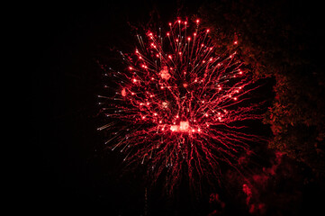 Red fireworks in the night sky