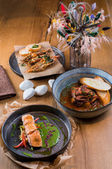 several dishes on the table, red fish and seafood