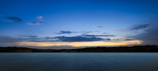 Empty floor with dramatic suset sky