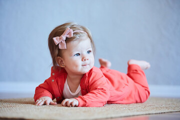 Naklejka premium A small newborn baby girl. The concept of childhood