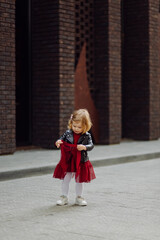 Parents and daughhter walking around the city. Spend time together. They are happy