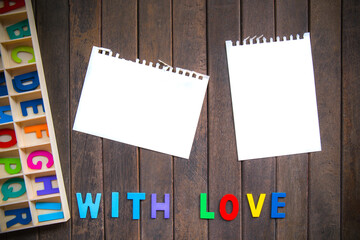 Abstract empty note with Red and Pink Heart Knitting on wood background. valentine greeting card copy space for add text message.