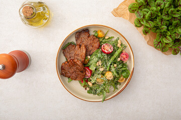 Portion of gourmet salad with roast beef