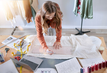 Fashion, designer and fabric woman with sewing tools, measuring tape and laptop for manufacturing,...