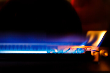 Gas boiler igniter. Gas is burning in the boiler.