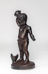 Purchased cast iron figurine close-up on a white background