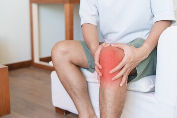 Man having knee ache and muscle pain due to Runners Knee or Patellofemoral Pain Syndrome,...