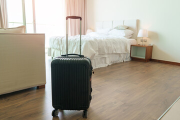 Black Luggage in modern hotel room after door opening. Baggage for Time to travel, service,...
