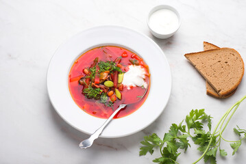 Original borscht or Botwinka or botwinya - traditional red beetroot soup with beet leaves, hot recipe of the Slavic countries: Ukrainian and Russian, Lithuanian, Belarusian and Polish