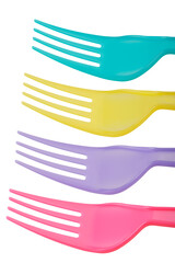 Close up of colorful plastic forks isolated on white background