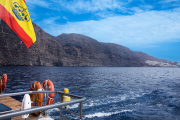 view of the coast of Tenerife over the ocean from the deck of the ship	