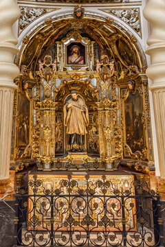 Seville, Spain - November 12, 2022: Altarpiece of San Luis Gonzaga, the young Jesuit saint, by Pedro Duque Cornejo, inside the Church of San Luis de los Franceses in the historic center of Seville