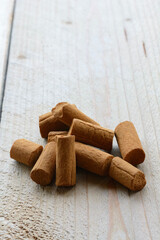 Chocolate cookies are on a wooden background. Pile of brown biscuits in the morning on the wooden table