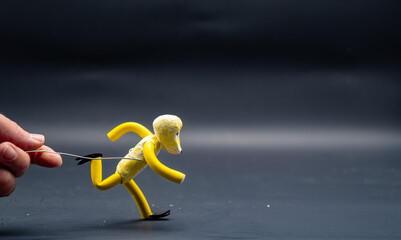 Process of running stopmotion. Full running process. Man's hand holding with aluminum wire a figure...