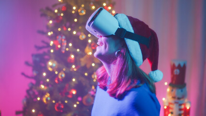 Happy girl with VR headset in Christmas room