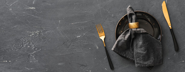 Simple table setting on black background with space for text