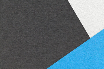Fototapeta premium Texture of craft black color paper background with blue and white border. Vintage abstract cardboard.