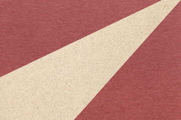 Texture of old craft maroon color paper background with beige line, macro. Structure of vintage abstract wine cardboard