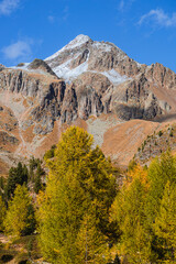 The mountains of the Val di Camp, a small valley near the village of Poschiavo, during an autumn day, Canton of Grisons, Switzerland - October 2022.