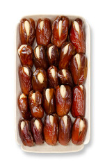 Almond-stuffed dates, in a balsa wood tray, from above. Sun dried Deglet Nour dates, pitted and filled with whole blanched almonds. A delicious sweet snack or dessert, originally from North Africa.