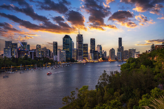 Dramatic sunset over Brisbane skyline and Brisbane river