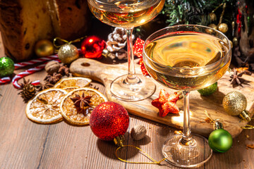 Merry Christmas and New Year holiday celebration with champagne. on wooden table with Christmas tree and decoration 