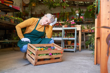 Female gardener with headache from overwork