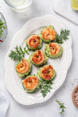 Cucumber Avocado Shrimp Appetizer. Canape with prawn, cucumber and guacamole, party food, finger food