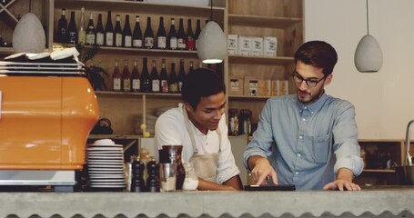 Cafe, tablet and manager talking with waiter for menu training or online orders. Small business, coffee shop and owner with touchscreen tech, inventory management app and coaching new employee. - Powered by Adobe