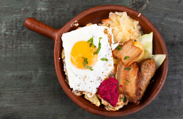 Breakfast dish - scrambled eggs with fried bacon