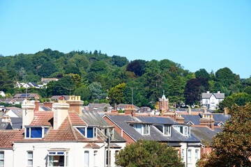 Elevated view over the town rooftops with the Devon countryside to the rear, Sidmouth, Devon, UK, Europe