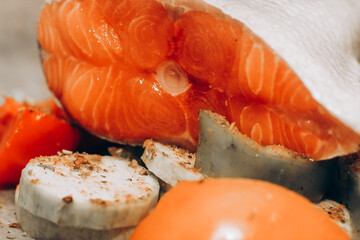 Red fish trout salmon ready for baking with vegetables.