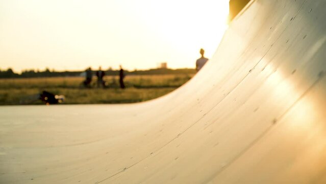 half pipe for skaters at sunset in slow motion