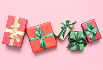 Beautiful Christmas gift boxes on pink background