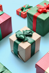 Beautiful Christmas presents on blue background, closeup