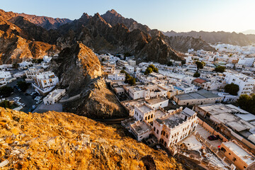 Mutrah Sunset. Cityscape View of Muscat at Beautiful Sunset. The Capital of Oman. Arabian Peninsula.