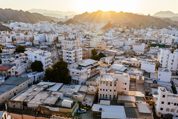 Obraz premium Mutrah Sunset. Cityscape View of Muscat at Beautiful Sunset. The Capital of Oman. Arabian Peninsula.