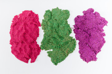 Colorful kinetic sand, plastic molds for sand. Top view. White background