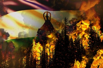 Forest fire natural disaster concept - burning fire in the trees on Lesotho flag background - 3D illustration of nature