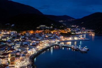 Parga town during blue hour, panoramic view of this picturesque coastal town at the Ionian sea, very close to Preveza city, in Epirus region, northern Greece, Europe