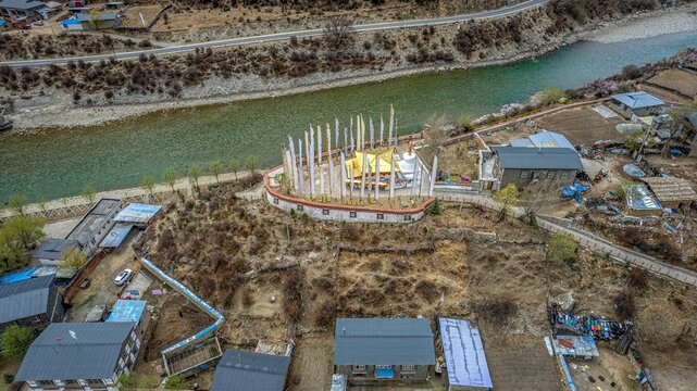 Aerial of a colorful temple with a pagoda in the middle of nature in Taizhao, Tibet