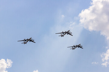 Air Force legend planes in sky. Three Russian turboprop strategic bombers Tu-95MS (NATO: - Medved) perform demonstration flight. 100 years of Russian Air Force. Zhukovsky, Russia, August 12, 2012