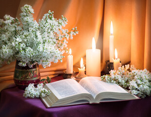 Still life from ancient book and lush boquet