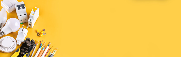 Electrical tools set with dimmer switch isolated on yellow background with copy space, controllable...