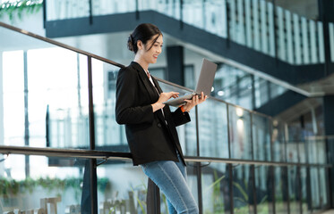 Portrait of a beautiful young Asian businesswoman at the company