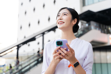 Happy smiling young woman on the street