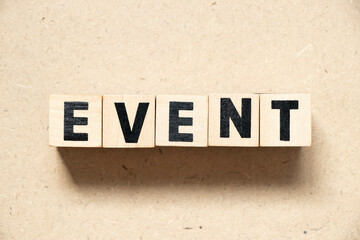 Alphabet letter block in word event on wood background
