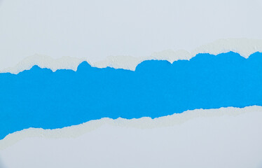 Torn paper on blue background